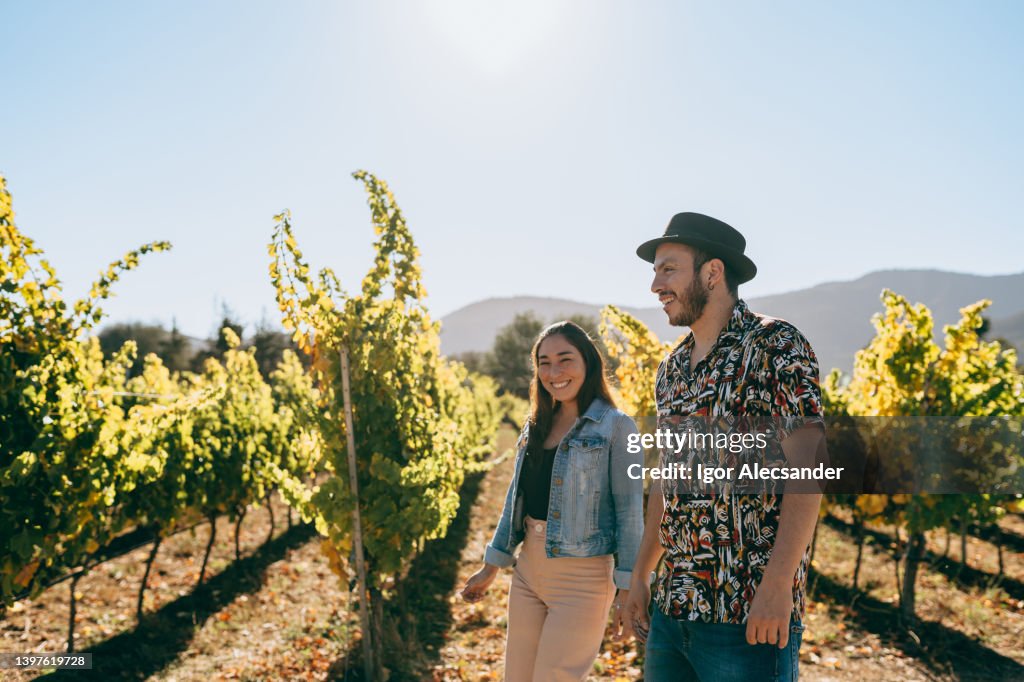 Couple visiting an organic vineyard