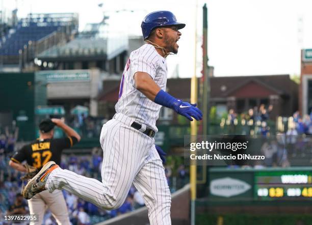 Willson Contreras of the Chicago Cubs celebrates hitting a grand slam off of Bryse Wilson of the Pittsburgh Pirates during the first inning of a game...