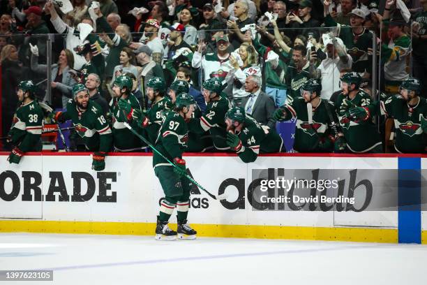 Kirill Kaprizov of the Minnesota Wild celebrates his goal against the St. Louis Blues with teammates in the first period in Game Five of the First...