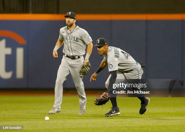 Julio Rodriguez and Steven Souza Jr. #21 of the Seattle Mariners in action against the New York Mets at Citi Field on May 13, 2022 in New York City....