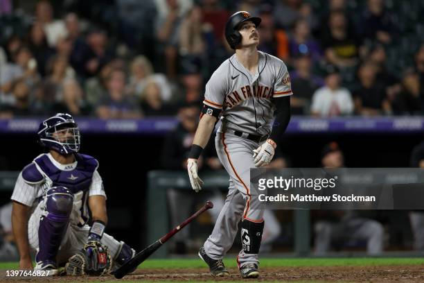 Mike Yazstrazemski of the San Francisco Giants hits a solo RBI home run against the Colorado Rockies in the ninth inning at Coors Field on May 16,...
