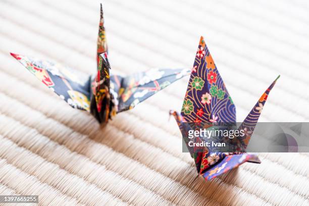japanese style origami cranes on tatami - folding origami stock pictures, royalty-free photos & images