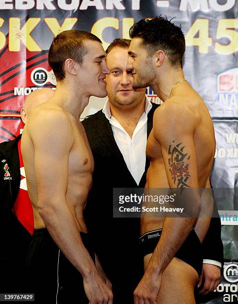 Nathan Cleverly and Tommy Karpency face off during their Weigh-In prior to the WBO Light Heaveyweight Title bout on February 24, 2012 in Cardiff,...