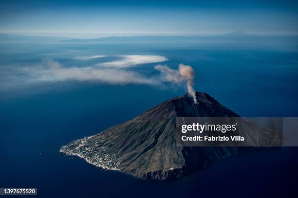 Aerial view, from a helicopter, of the Stromboli volcano, one of the most active volcanoes in the world, during an explosion with gas and ash...