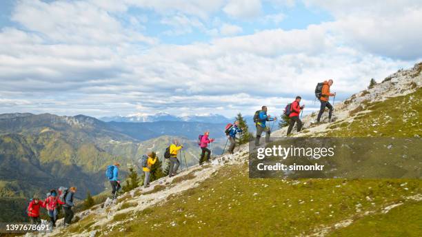 friends hiking on mountain - slovenia stock pictures, royalty-free photos & images