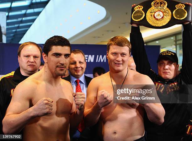 Marco Huck of Germany and Alexander Povetkin of Russia pose for the media during the weigh in for their upcoming WBA World Championship Heavyweight...