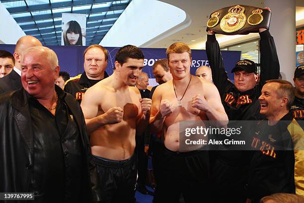 Coach Uli Wegner, Marco Huck of Germany, Alexander Povetkin of Russia and coach Alexander Zimin pose during the weigh in for their upcoming WBA World...