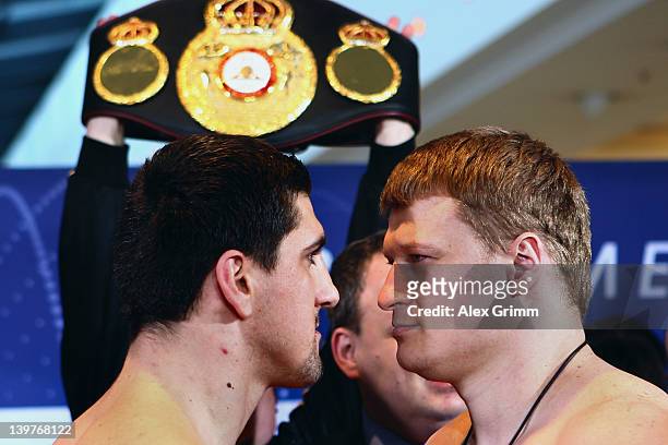 Marco Huck of Germany and Alexander Povetkin of Russia pose for the media during the weigh in for their upcoming WBA World Championship Heavyweight...