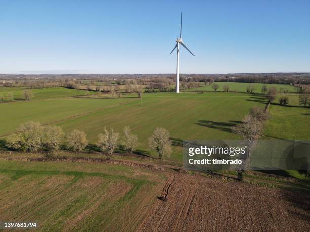 wind turbine in rural landscape, champdeniers-saint-denis, deux-sevres, france - deux sevres - fotografias e filmes do acervo