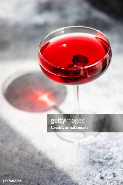 blackberry cocktail in a champagne coupe - coupe dessert stock pictures, royalty-free photos & images