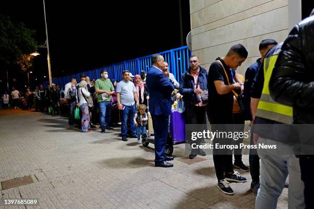 People wait to cross the Spanish-Moroccan border in Melilla, May 17 in Melilla, Spain. Spain and Morocco have reached an agreement to reopen the land...