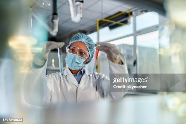 african american scientist working on antiviral drug in laboratory. - drug evaluation stock pictures, royalty-free photos & images
