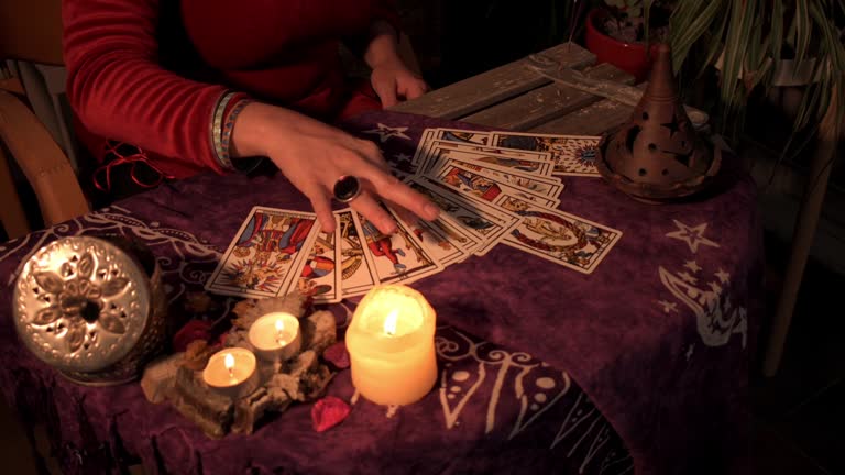 https://media.gettyimages.com/id/1397704487/video/close-up-of-a-fortune-teller-displaying-some-tarot-cards-on-a-wooden-table.jpg?b=1&s=640x640&k=20&c=mGCE34b9Mnky3AmMZwIkxe1a-r4GYdOzbWo0UOnDh2E=
