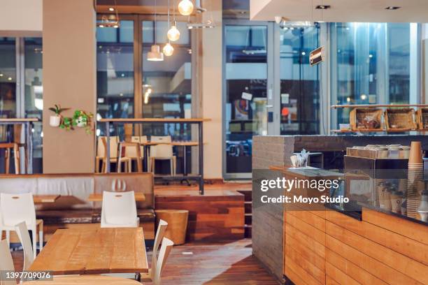 shot if an empty cafe after hours - restaurant background stock pictures, royalty-free photos & images