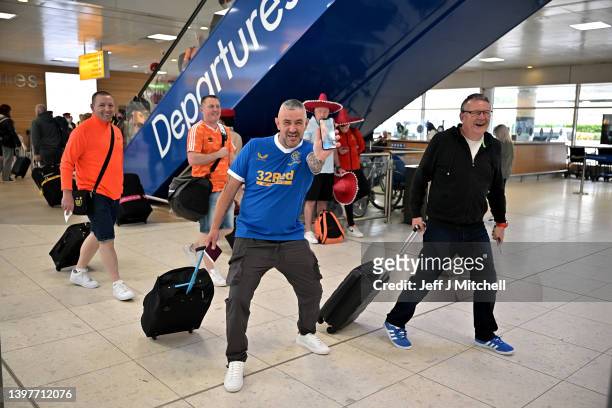 Rangers fans gather at Glasgow airport as they depart Scotland ahead of the Europa League final on May 17, 2022 in Glasgow, Scotland. Rangers will...
