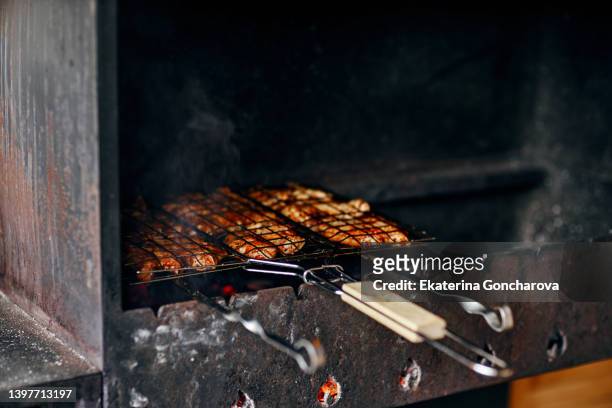 close-up of pork meat on barbecue grill - rib food stock pictures, royalty-free photos & images