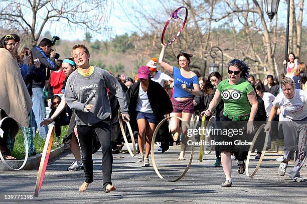 Wellesley College seniors participate in the 114th annual hoop-rolling contest on the grounds of the campus, Saturday, April 25, 2009. The winner, it...