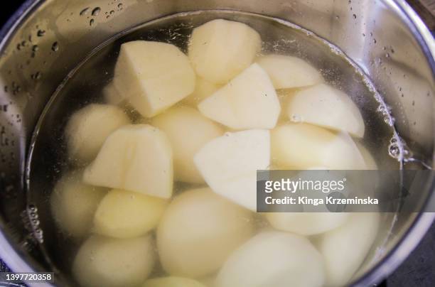 boiling potatoes - boiled stock pictures, royalty-free photos & images