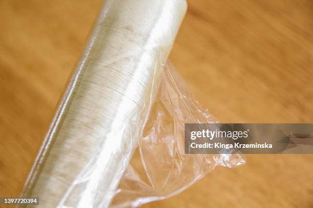 cling film - plastic folie stockfoto's en -beelden