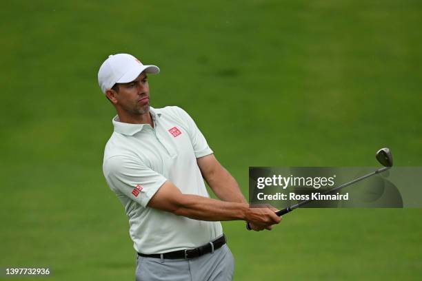 Adam Scott of Australia chips on the 16th green during a practice round prior to the start of the 2022 PGA Championship at Southern Hills Country...