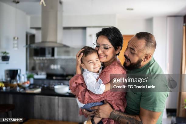 family together at home - happy couple stock pictures, royalty-free photos & images
