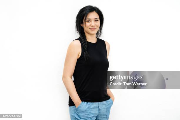 portrait of woman with platted black hair - sleeveless stock pictures, royalty-free photos & images