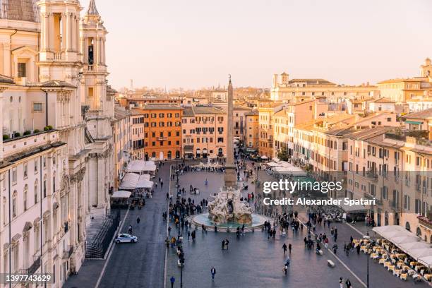 rome skyline and piazza navona at sunset seen from above, lazio, italy - piazza navona stock-fotos und bilder