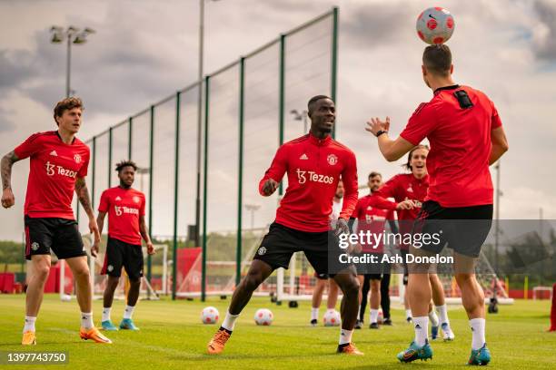 Eric Bailly and Diogo Dalot of Manchester United in action during a first team training session at Carrington Training Ground on May 17, 2022 in...