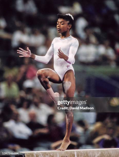 Dominique Dawes of the United States competes on the Balance Beam on July 28, 1992 during the Team All-Around event of the Women's Gymnastics...