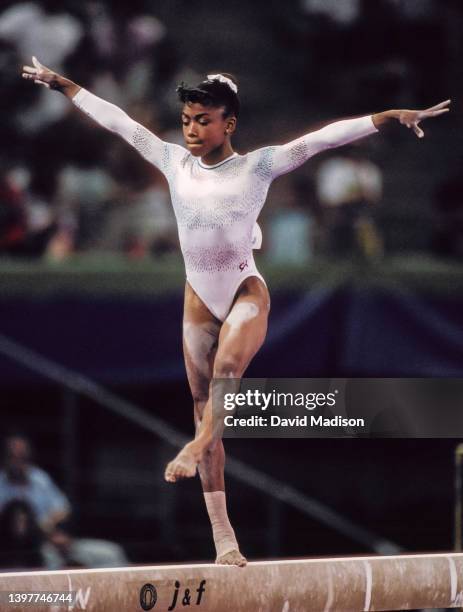 Dominique Dawes of the United States competes on the Balance Beam on July 28, 1992 during the Team All-Around event of the Women's Gymnastics...