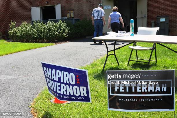People prepare to vote in the Pennsylvania Primary election at Brownstone Masonic Temple on May 17, 2022 in Hershey, Pennsylvania. Pennsylvanians are...