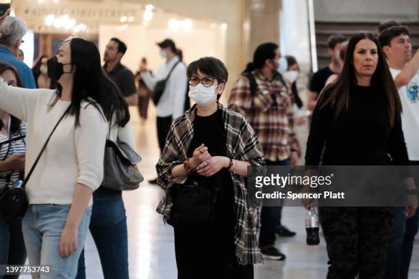 Woman wears a mask indoors in Manhattan on May 17, 2022 in New York City. New York’s health commissioner, Dr. Ashwin Vasan, has moved from a "medium"...