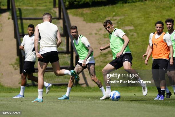 Ante Rebic and Daniel Maldini in action during an AC Milan training session at Milanello on May 17, 2022 in Cairate, Italy.