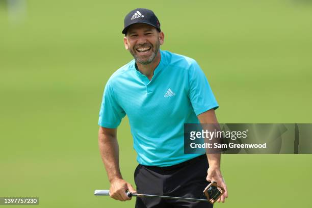 Sergio Garcia of Spain smiles as he walks along the third hole during a practice round prior to the start of the 2022 PGA Championship at Southern...