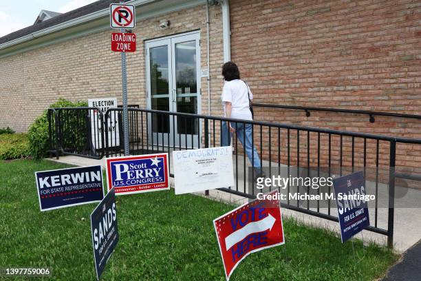 People prepare to vote in the Pennsylvania Primary election at St. Thomas United Church of Christ on May 17, 2022 in Harrisburg, Pennsylvania....