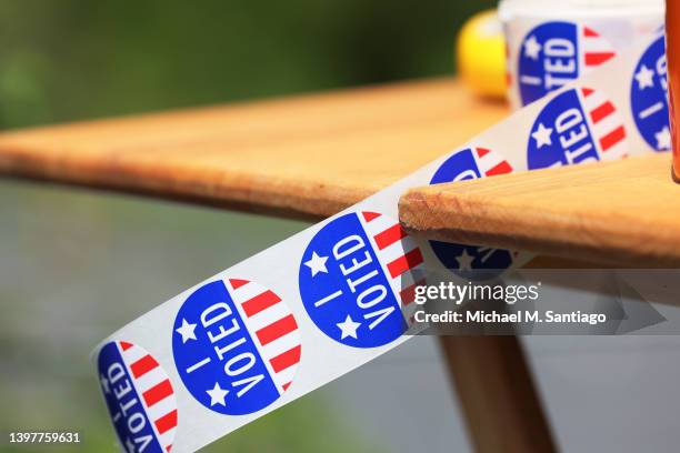 Voted" stickers are seen on a table during the Pennsylvania Primary election at St. Thomas United Church of Christ on May 17, 2022 in Harrisburg,...
