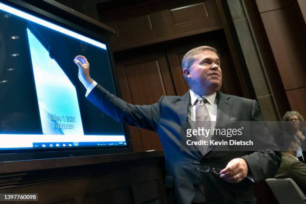 Deputy Director of Naval Intelligence Scott Bray explains a video of an unidentified aerial phenomena, as he testifies before a House Intelligence...