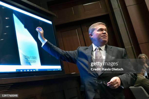 Deputy Director of Naval Intelligence Scott Bray explains a video of an unidentified aerial phenomena, as he testifies before a House Intelligence...