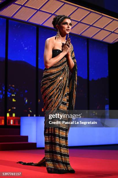 Jury member Deepika Padukone arrives on stage during the opening ceremony for the 75th annual Cannes film festival at Palais des Festivals on May 17,...