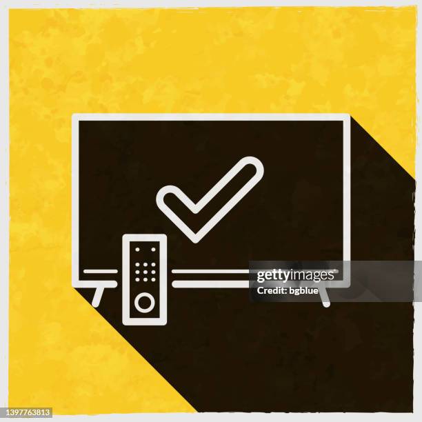tv with check mark. icon with long shadow on textured yellow background - remote support stock illustrations
