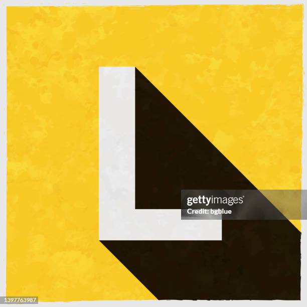 letter l. icon with long shadow on textured yellow background - letter l stock illustrations