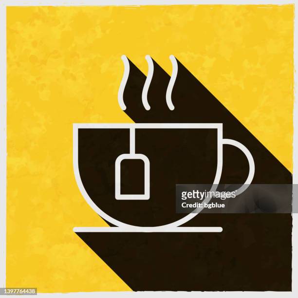 cup of tea. icon with long shadow on textured yellow background - tea cup stock illustrations