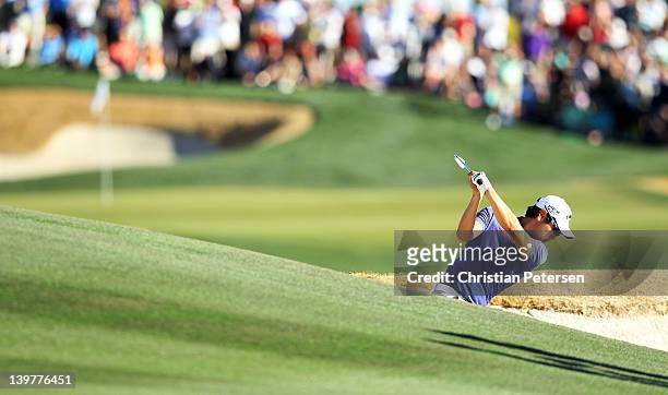 Sang-moon Bae of South Korea hits his second shot from a bunker on the 18th hole during the third round of the World Golf Championships-Accenture...