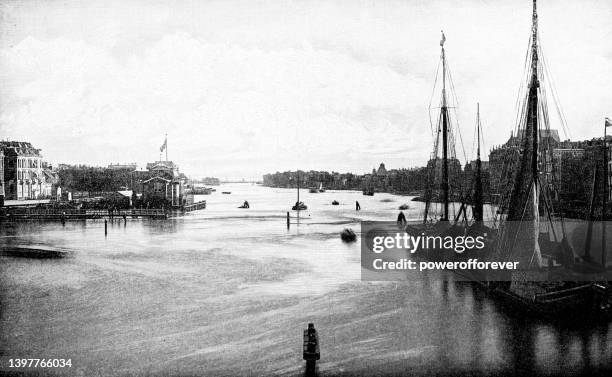 amstel river in amsterdam, netherlands - 19th century - amstel river stock illustrations