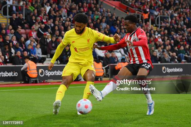 Joe Gomez of Liverpool is challenged by Nathan Tella of Southampton during the Premier League match between Southampton and Liverpool at St Mary's...