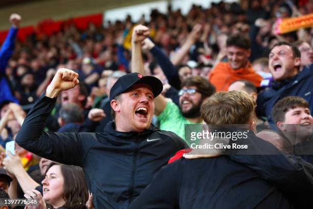 Liverpool fans celebrate after Takumi Minamino scores their sides first goal during the Premier League match between Southampton and Liverpool at St...
