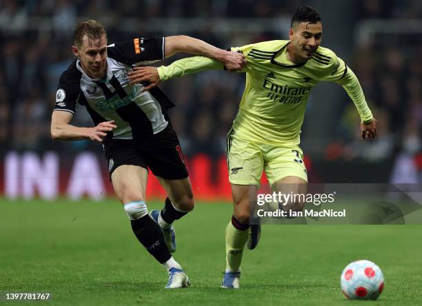 Gabriel Martinelli of Arsenal battles for possession with Emil Krafth of Newcastle United during the Premier League match between Newcastle United...