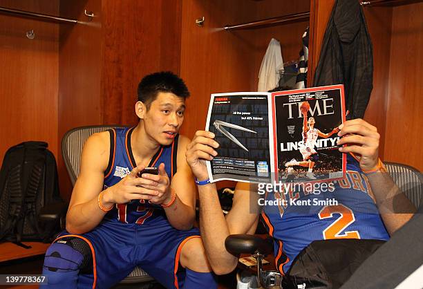 Jeremy Lin and Landry Fields of Team Shaq read a magazine before the BBVA Rising Stars Challenge as part of 2012 All-Star Weekend at the Amway Center...