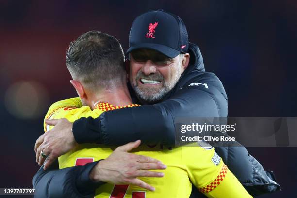 Jurgen Klopp, Manager of Liverpool celebrates their sides victory with Jordan Henderson of Liverpool after the Premier League match between...