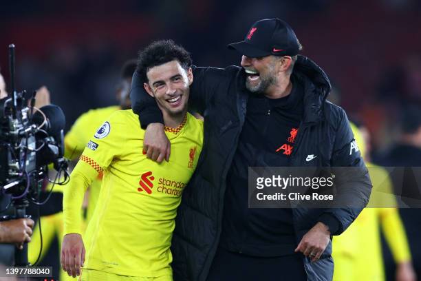Jurgen Klopp, Manager of Liverpool celebrates their sides victory with Curtis Jones of Liverpool after the Premier League match between Southampton...